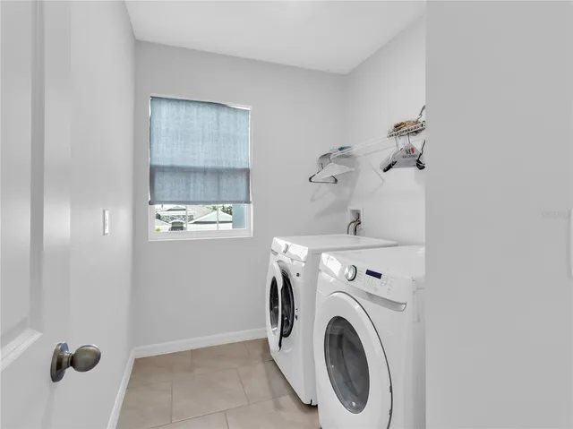 a bedroom with furniture and a wooden floor