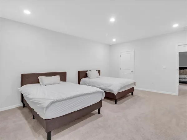 a bathroom with a shower sink and mirror