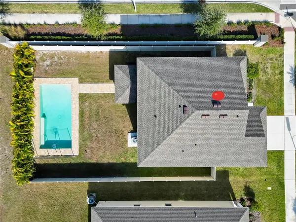 an aerial view of residential houses with outdoor space