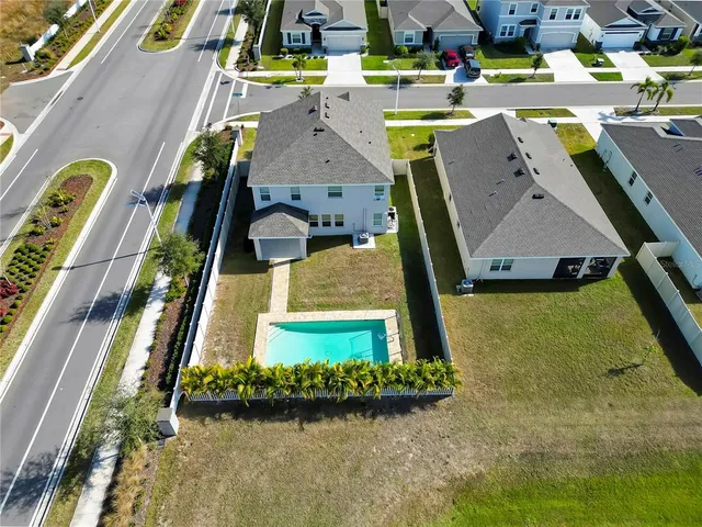 an aerial view of a house with a garden