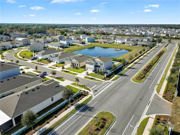 an aerial view of residential houses with outdoor space