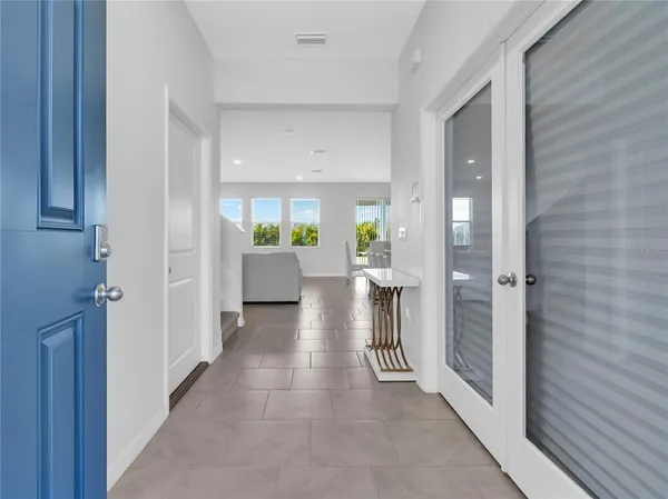 a view of an entryway with chandelier