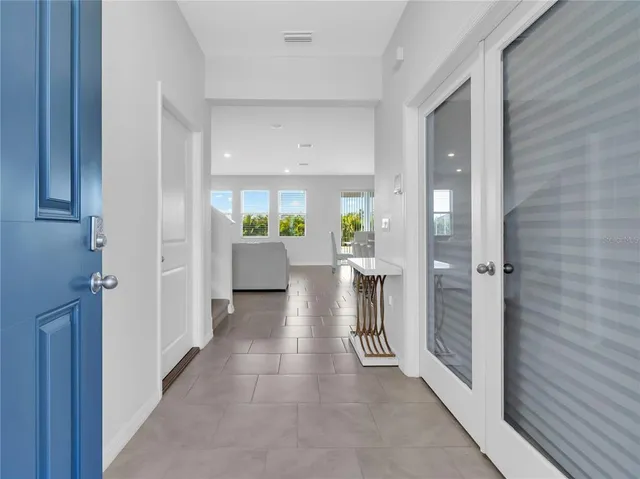 a view of an entryway with chandelier