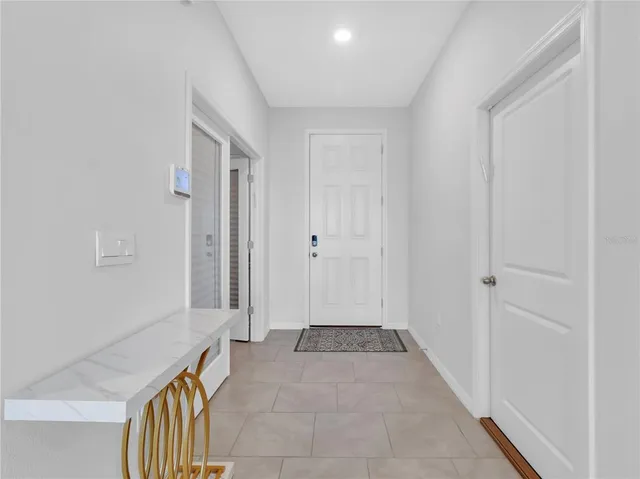 a kitchen with appliances a sink and cabinets