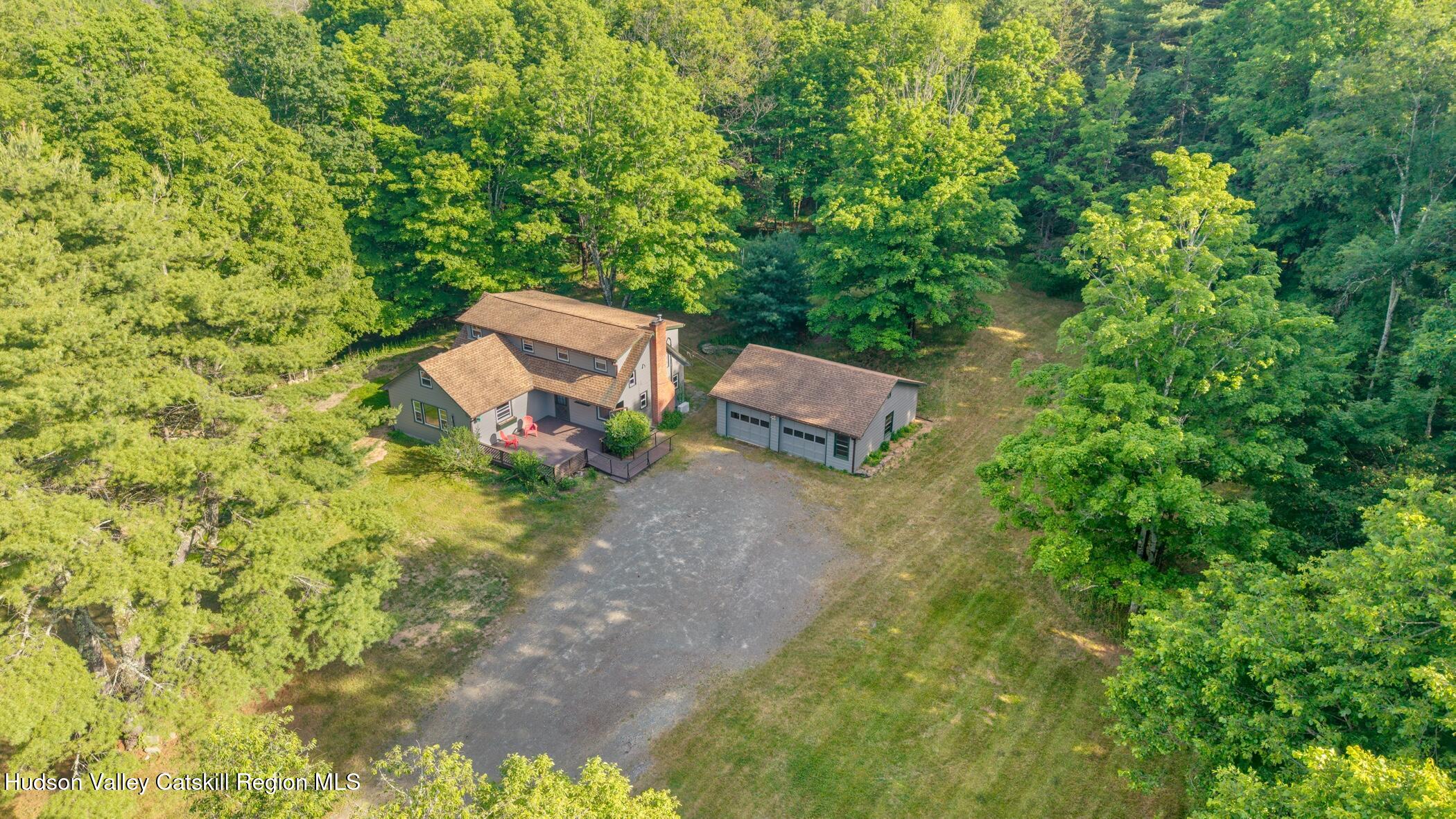 4533 Atwood Road Stone Ridge, NY 12484 - Photo 59 of 63 a backyard of a house with table and chairs