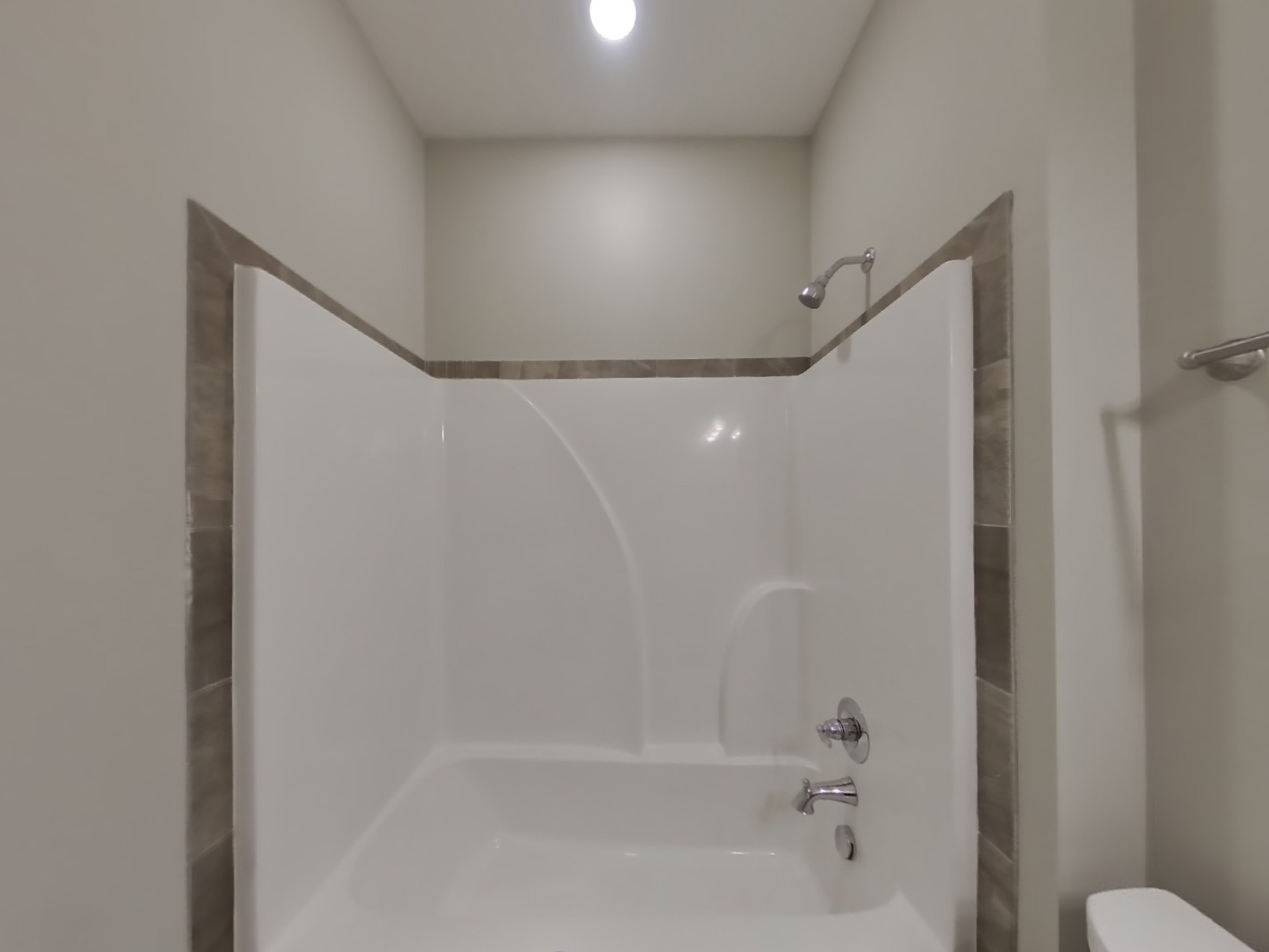 815 Ellyson Drive Spring Hill, TN 37174 - Photo 14 of 16 a bathroom with a shower and a toilet