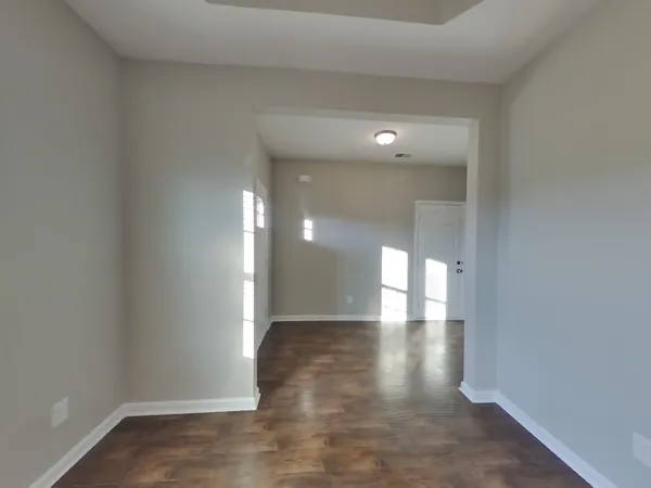 a kitchen with stainless steel appliances granite countertop a sink refrigerator and cabinets