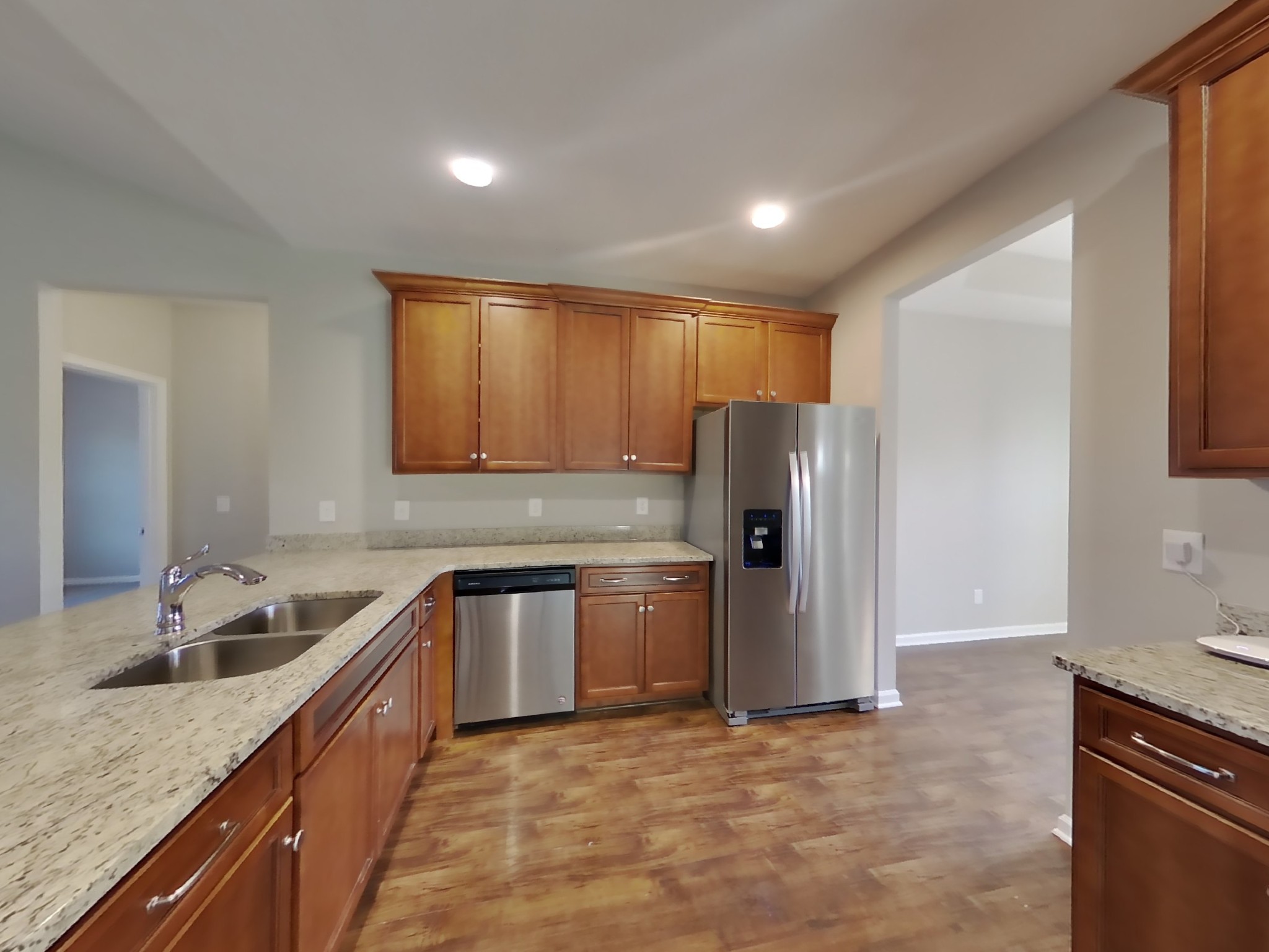 815 Ellyson Drive Spring Hill, TN 37174 - Photo 5 of 16 a kitchen with stainless steel appliances granite countertop a sink stove and refrigerator