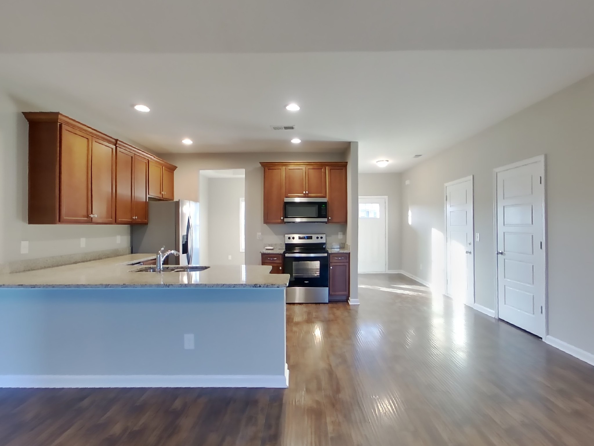815 Ellyson Drive Spring Hill, TN 37174 - Photo 6 of 16 a kitchen with stainless steel appliances granite countertop a sink refrigerator and cabinets