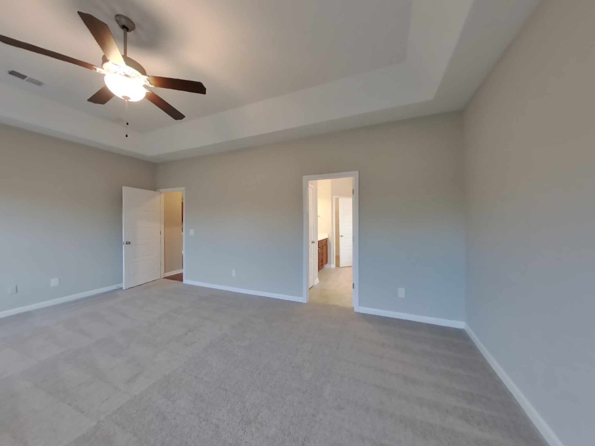 815 Ellyson Drive Spring Hill, TN 37174 - Photo 8 of 16 an empty room with a chandelier fan and windows