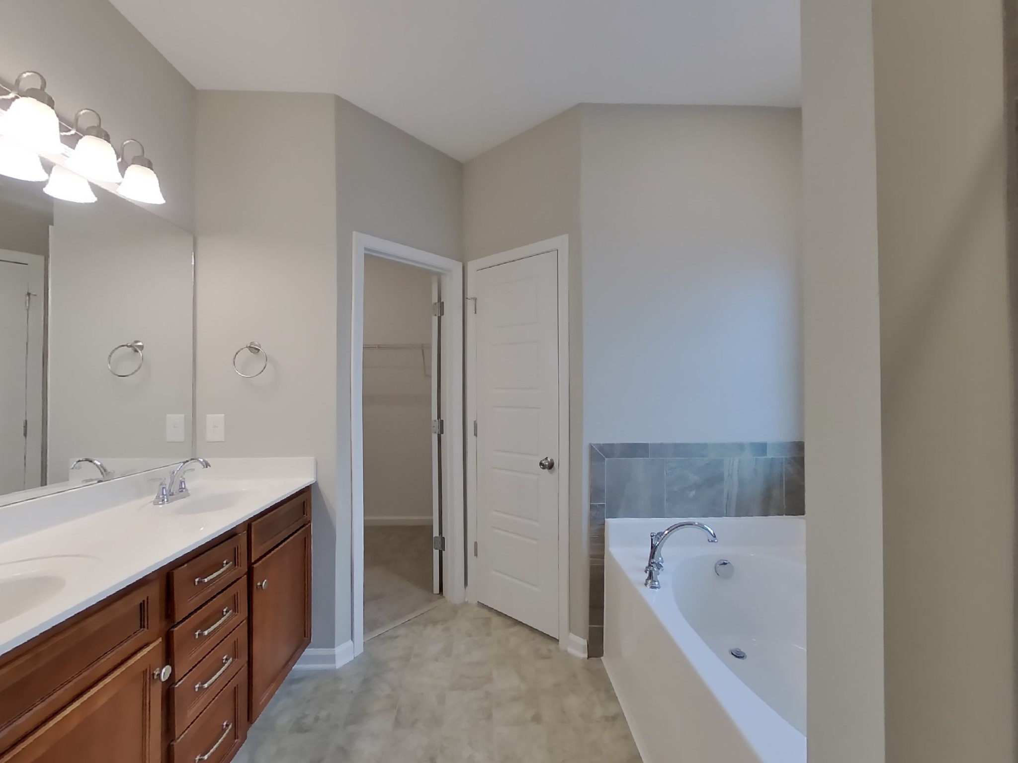 815 Ellyson Drive Spring Hill, TN 37174 - Photo 9 of 16 a spacious bathroom with a tub sink and mirror