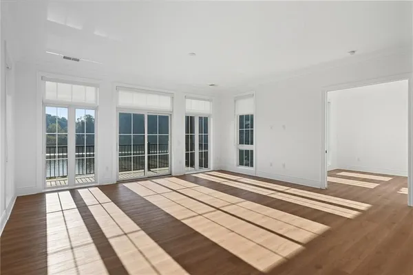 a view of a living room with kitchen