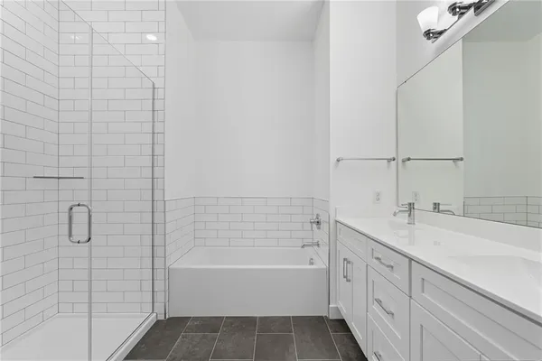 a close view of a utility room with dryer and washer