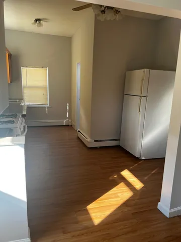 a view of a livingroom with wooden floor