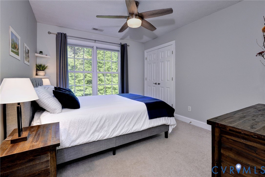 4015 Cold Spring Road Williamsburg, VA 23188 - Photo 31 of 57 Carpeted room featuring a double window with exter