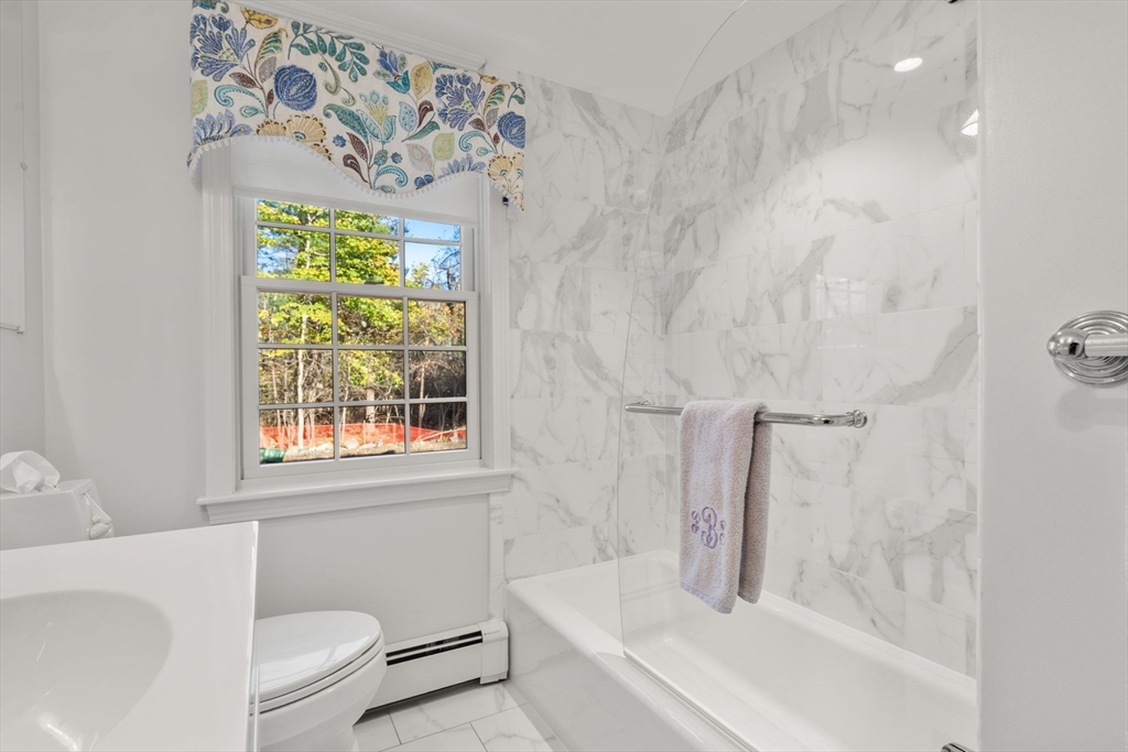 31 White Road Wayland, MA 01778 - Photo 16 of 36 a bath room with a toilet and a bath tub