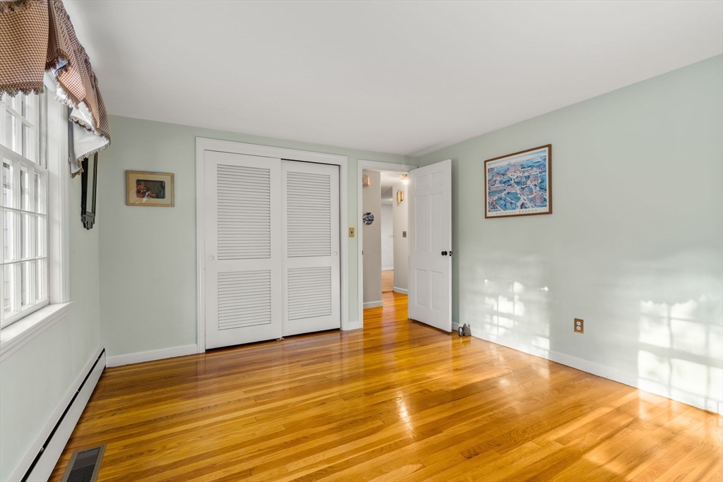 31 White Road Wayland, MA 01778 - Photo 18 of 36 a view of an empty room with window and wooden floor
