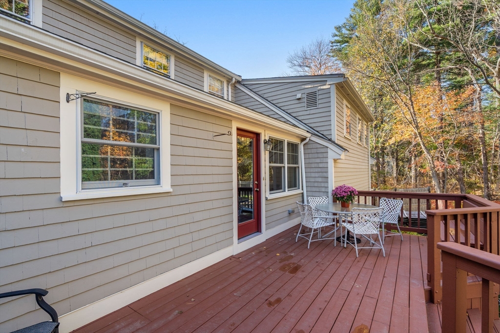 31 White Road Wayland, MA 01778 - Photo 3 of 36 a balcony with furniture and wooden floor