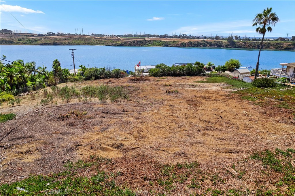 0 Adams Street Carlsbad, CA 92008 - Photo 9 of 23 a view of a lake with table and chairs
