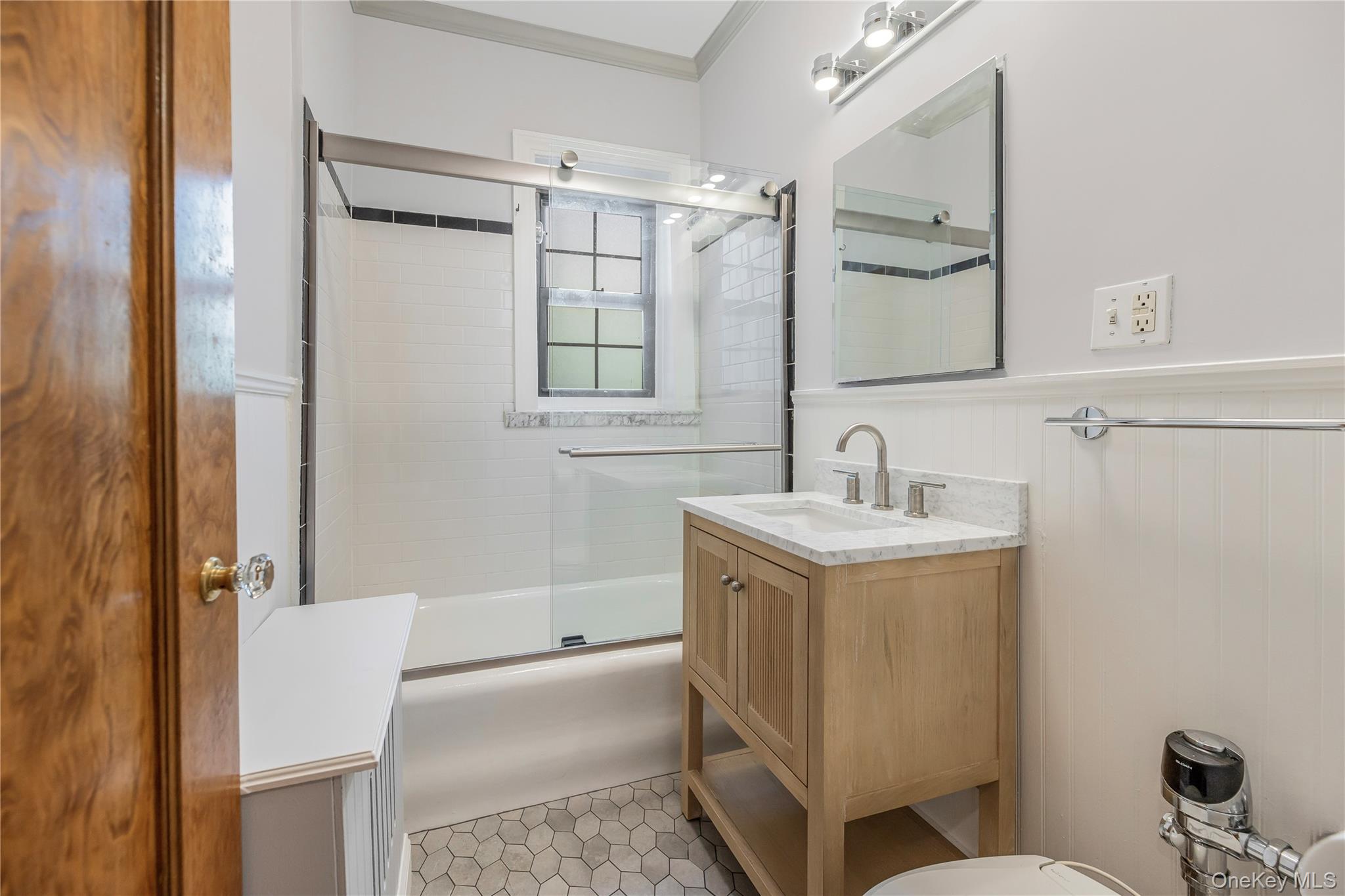 26 Pondfield Road, Unit 1D Bronxville, NY 10708 - Photo 16 of 21 a bathroom with a sink toilet and shower