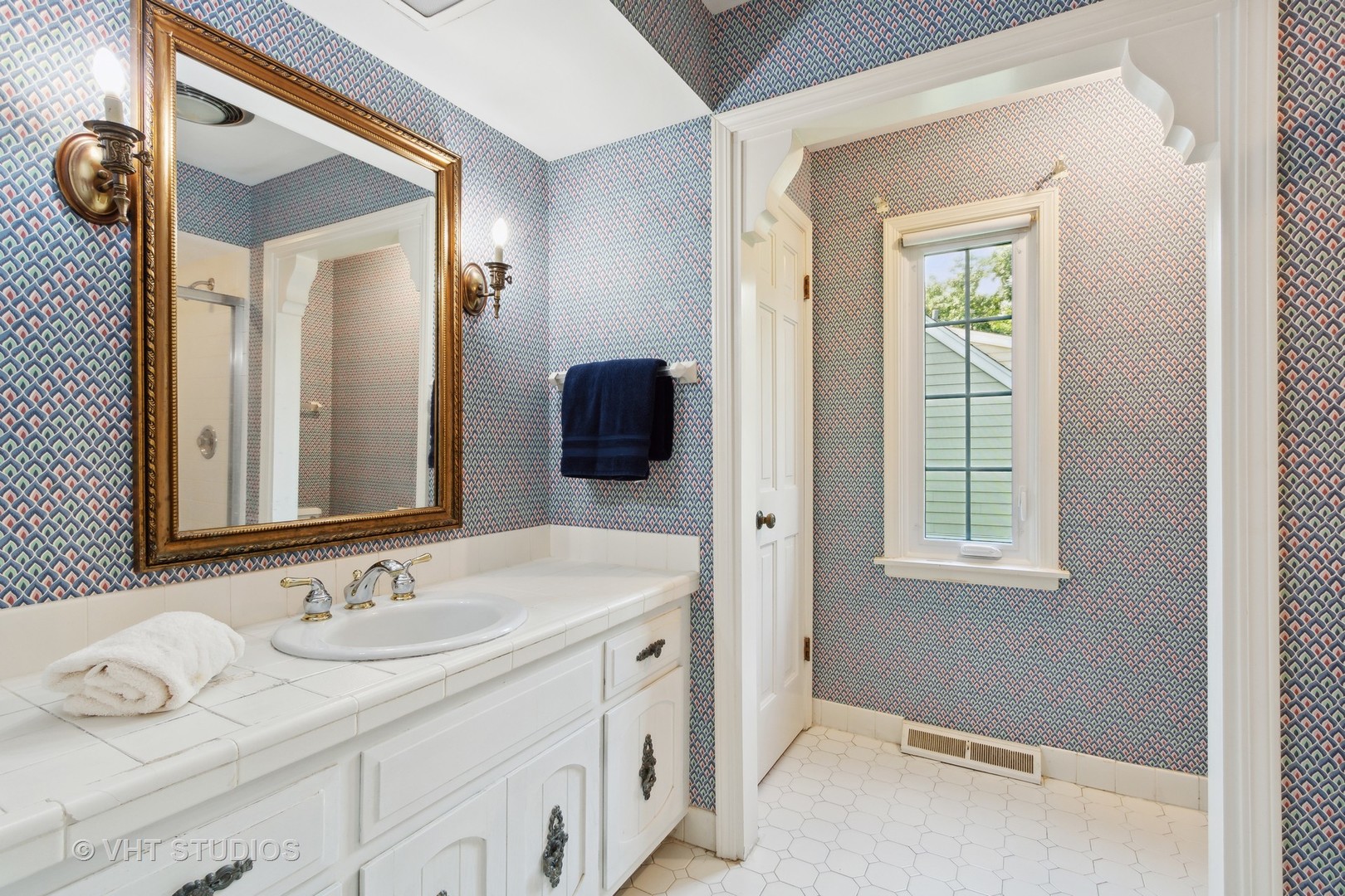 395 North Valley Road Barrington, IL 60010 - Photo 19 of 45 a bathroom with a sink and a mirror