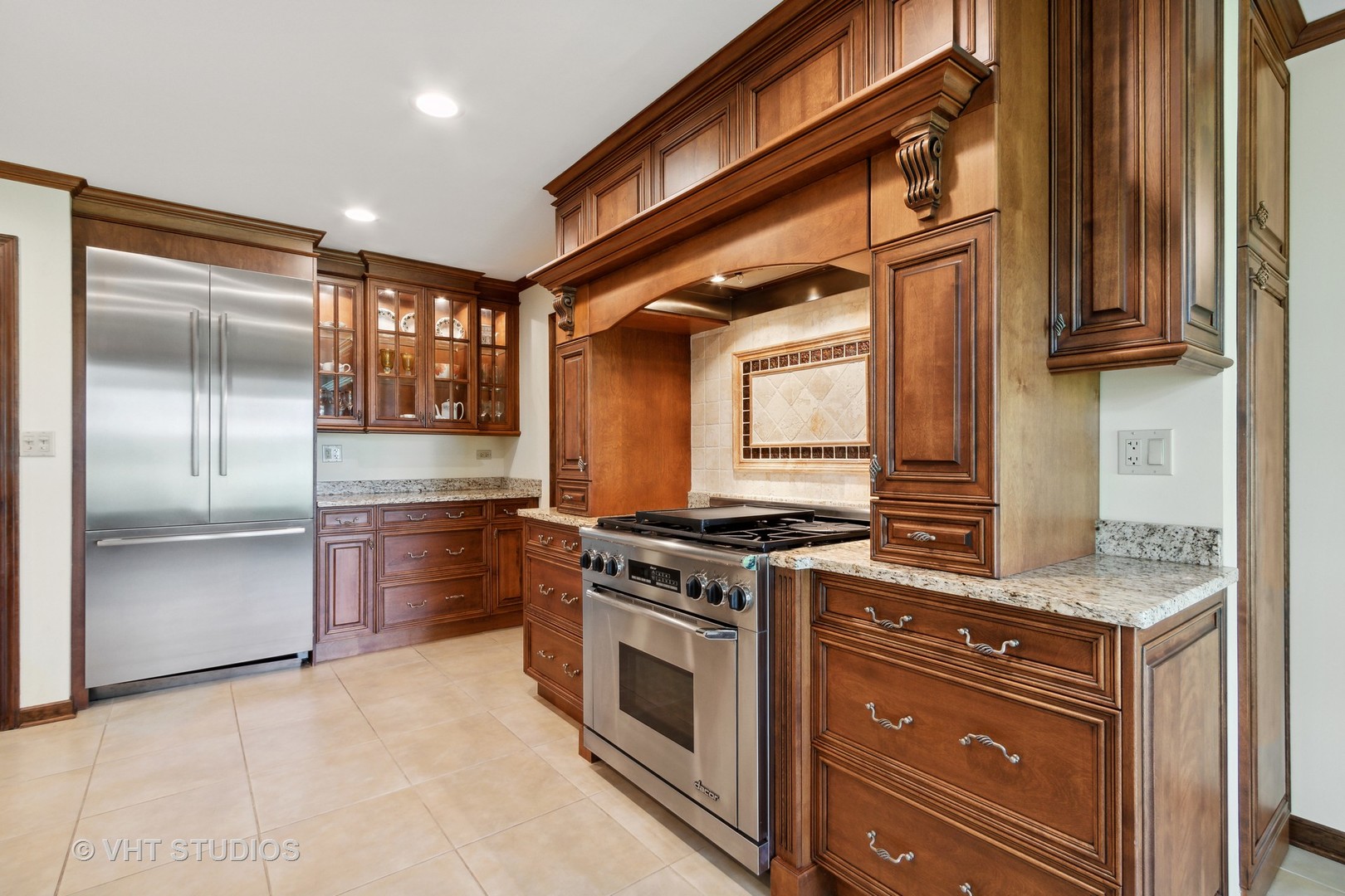 395 North Valley Road Barrington, IL 60010 - Photo 6 of 45 a kitchen with stainless steel appliances granite countertop a stove and a refrigerator