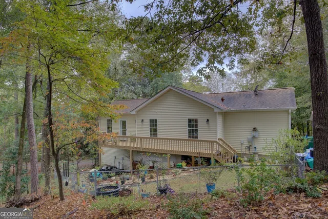 a kitchen with stainless steel appliances granite countertop a sink a stove and a wooden floors