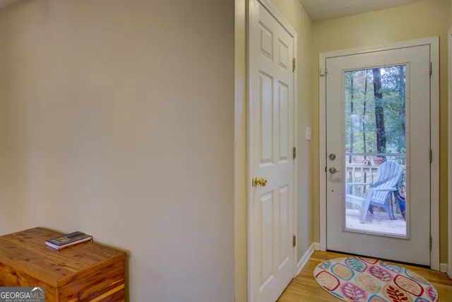 a view of a dining room with furniture and a chandelier