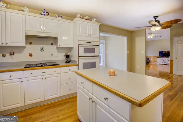 a balcony with wooden floor and fence