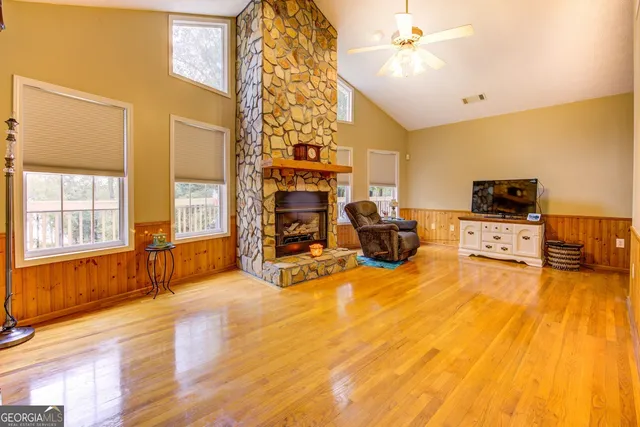 a view of livingroom with hardwood floor and a sink