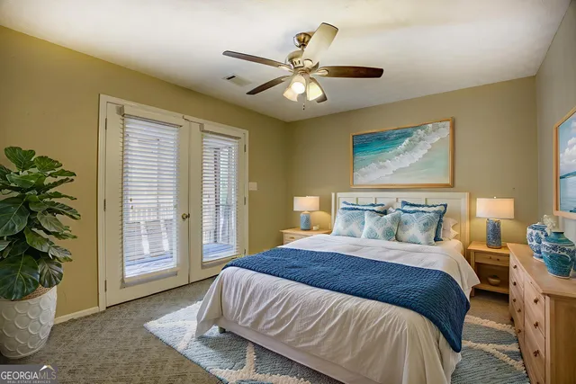 an aerial view of residential house with outdoor space and trees all around