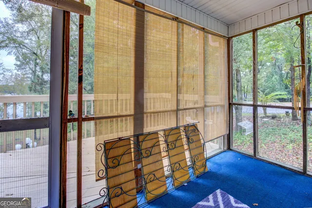 a front view of house with outdoor space and trees around