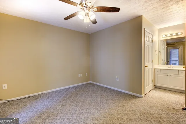 a view of a house with a yard and porch