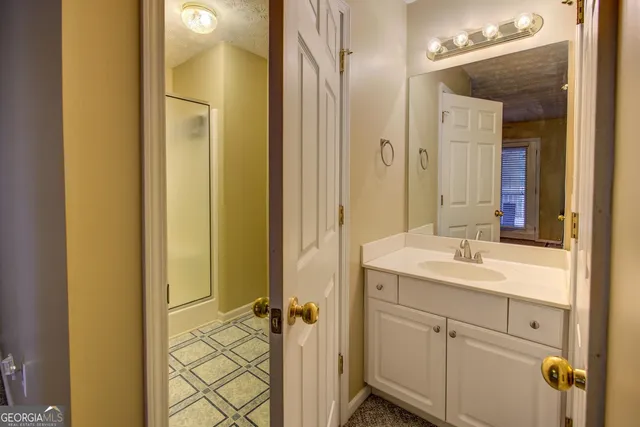 a view of a field with an trees in the background