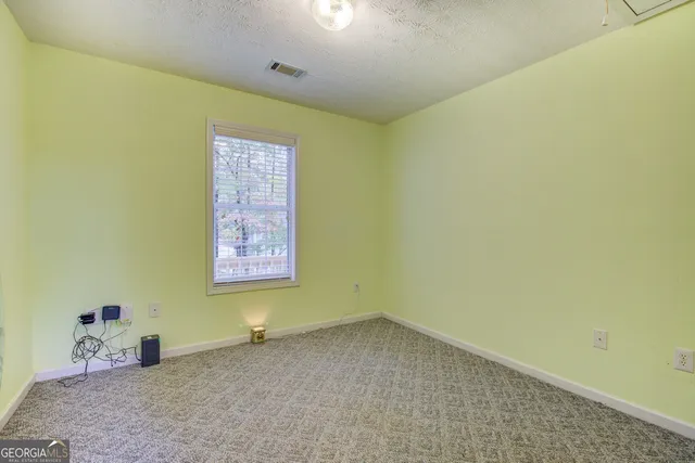 a view of an ocean beach and mountain