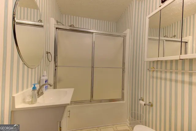 a swimming pool with outdoor seating and deck