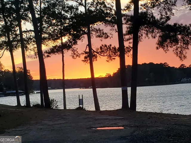 a front view of a house with a yard table and chairs