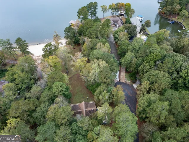 a front view of brick house with a yard