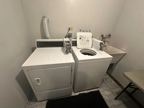 a utility room with dryer and washer