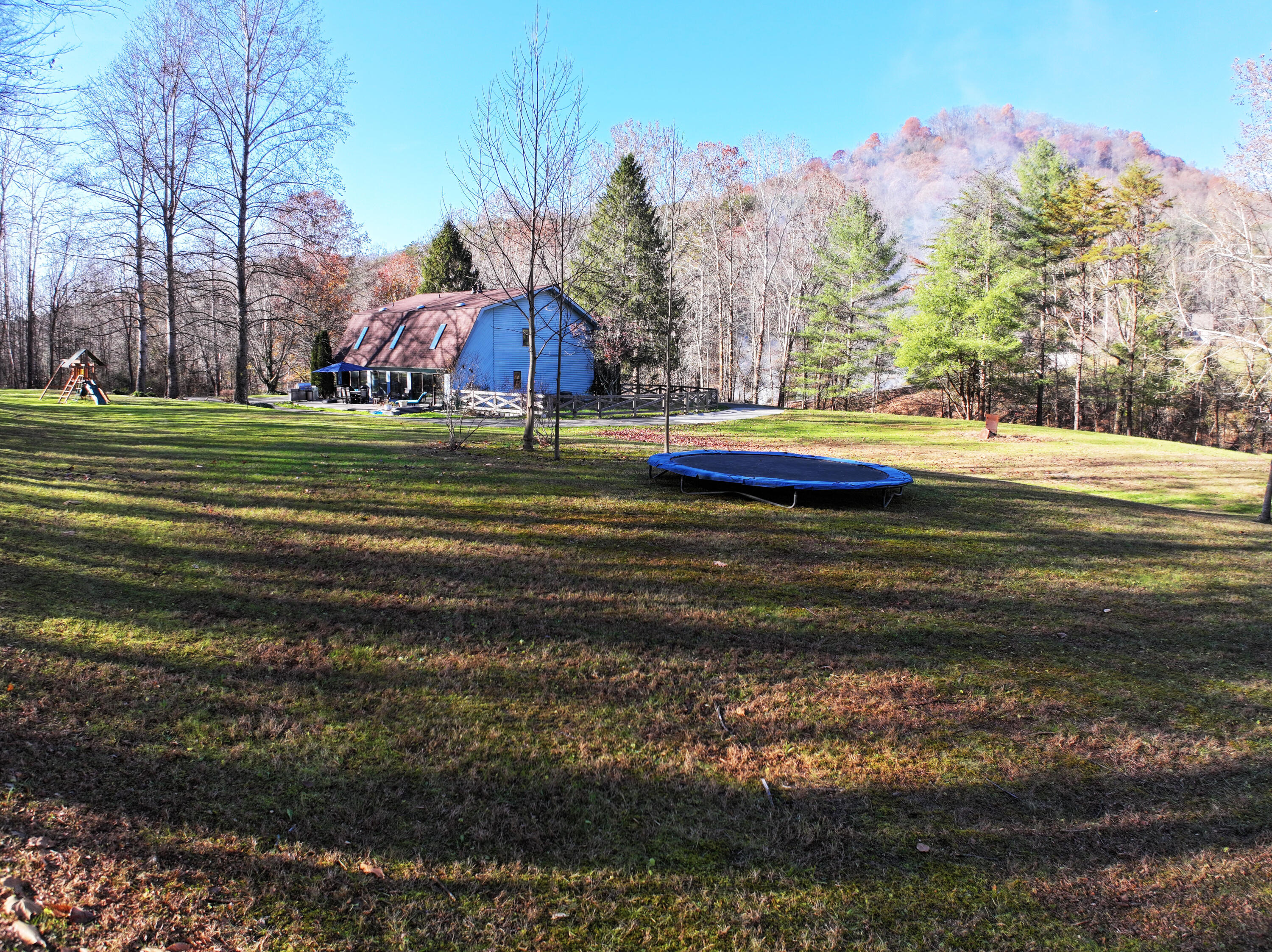 820 Sweet Lick Road Ravenna, KY 40472 - Photo 11 of 73 Beautiful country lawn framed by Appalachian hills—ideal for families who value space, safety, and fresh air!