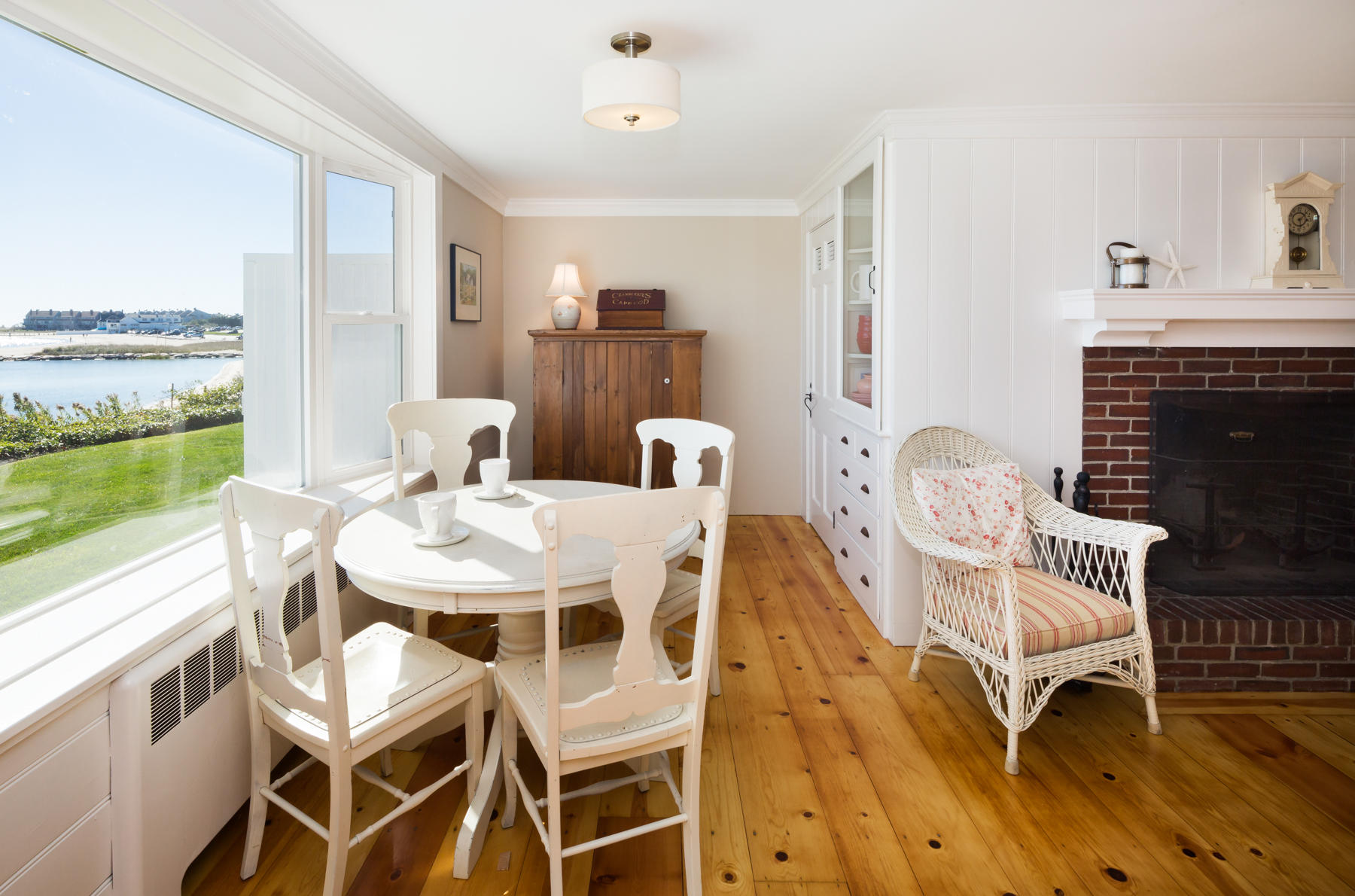 97 Harbor Bluff Road Hyannis, MA 02601 - Photo 18 of 33 a view of a dining room with furniture window and wooden floor