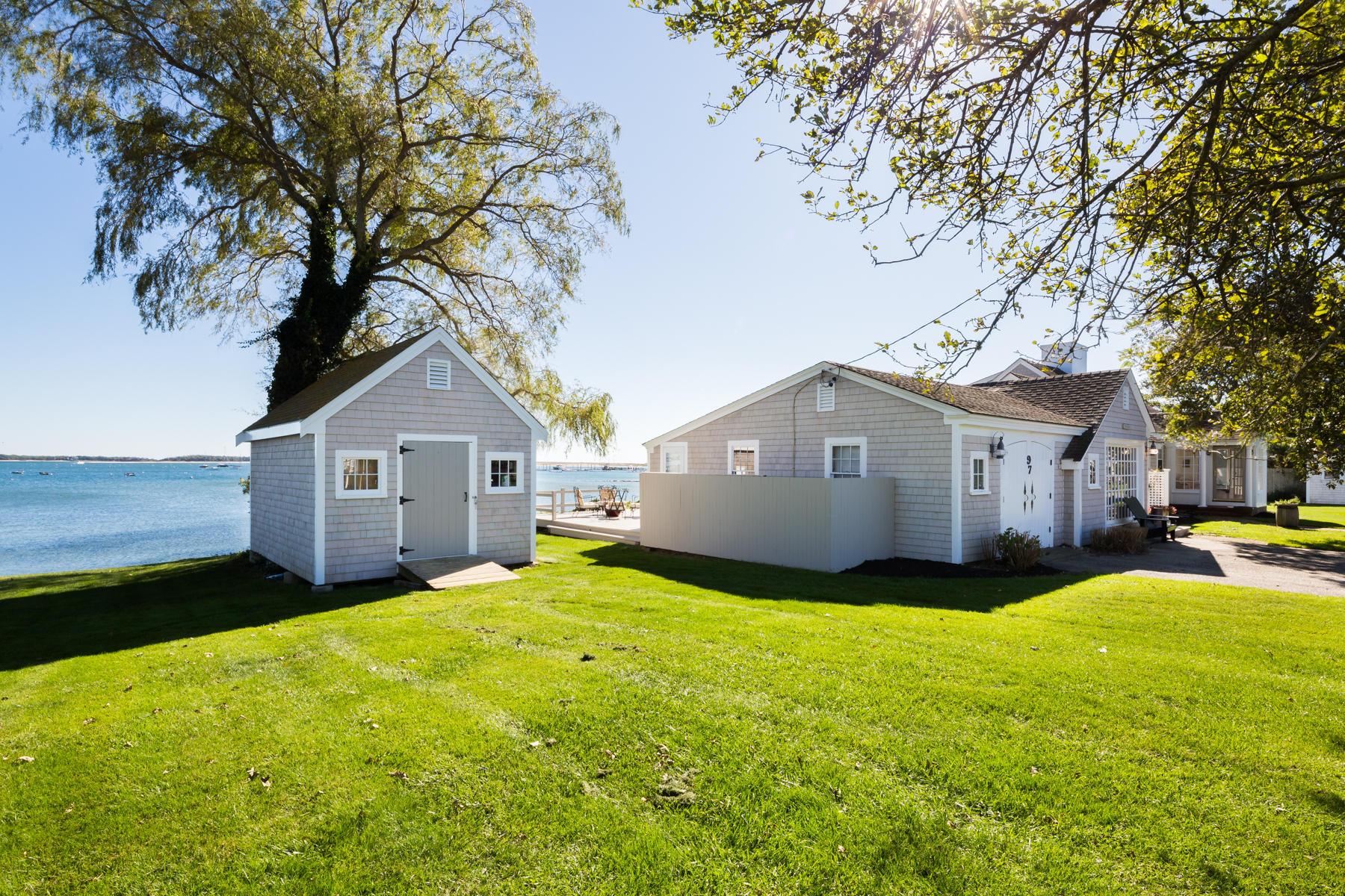 97 Harbor Bluff Road Hyannis, MA 02601 - Photo 5 of 33 a front view of a house with yard and trees