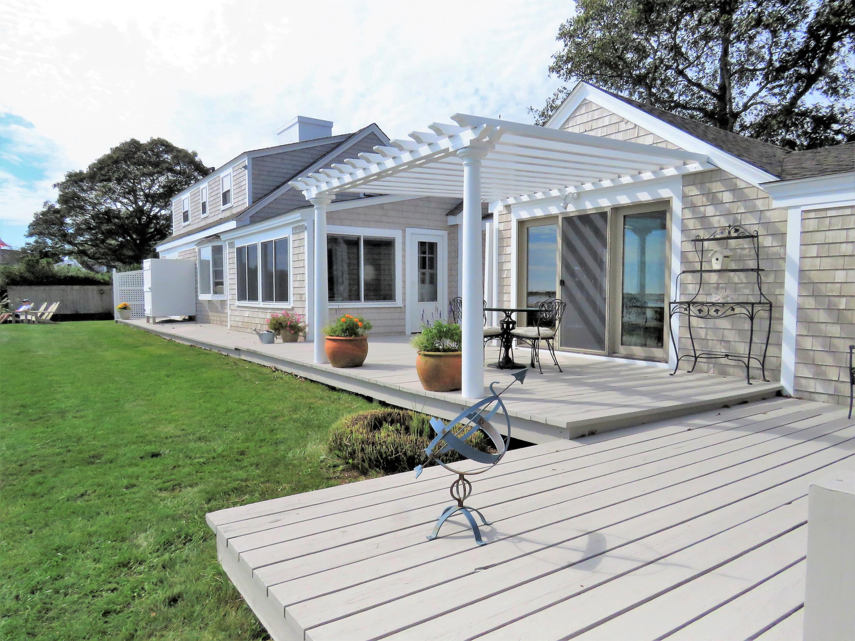 97 Harbor Bluff Road Hyannis, MA 02601 - Photo 10 of 33 a front view of a house with garden