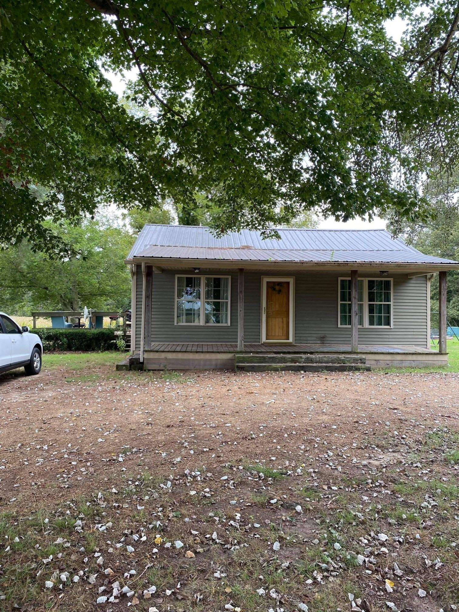 1925 Oak Ridge Road Obion, TN 38240 - Photo 1 of 13 a front view of a house with a garden