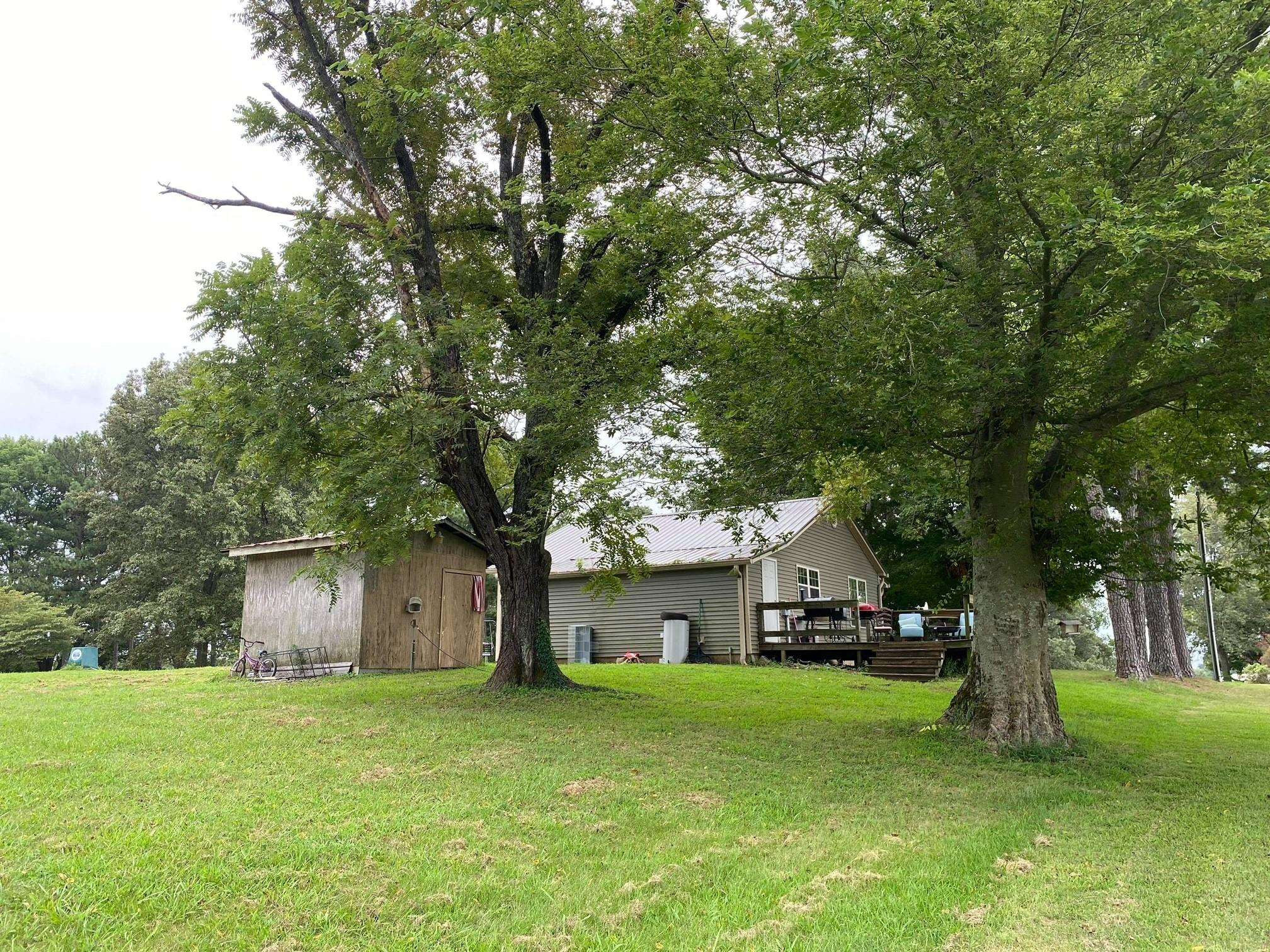 1925 Oak Ridge Road Obion, TN 38240 - Photo 11 of 13 a front view of house with a garden and trees