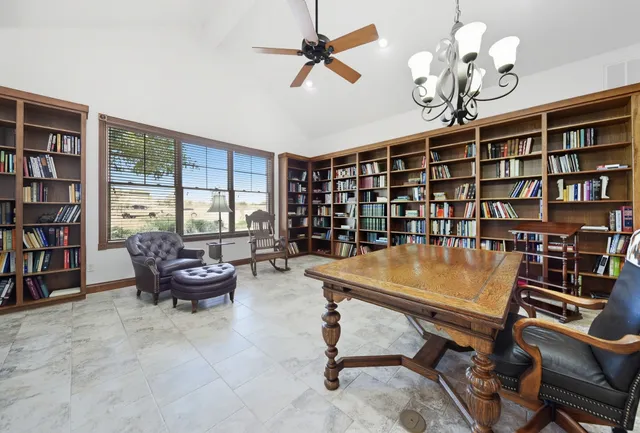 a room with furniture and book shelf
