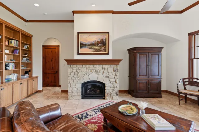 a living room with furniture and a fireplace