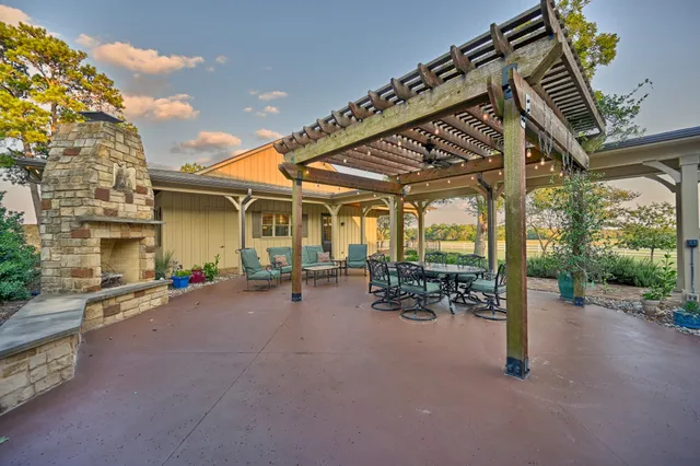 a dining room with a wooden table and chairs