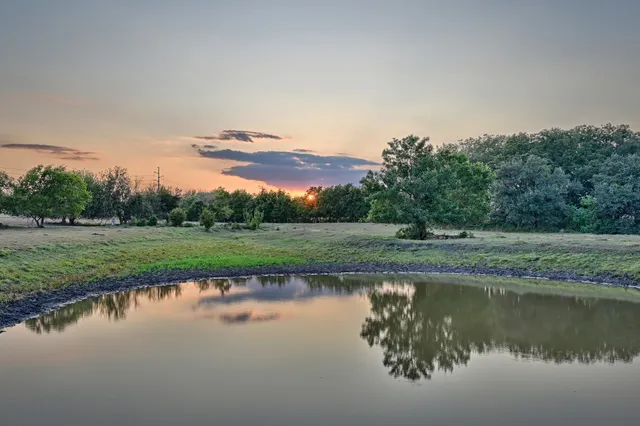 a view of lake with green space