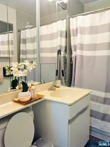 a kitchen with a table chairs sink and cabinets